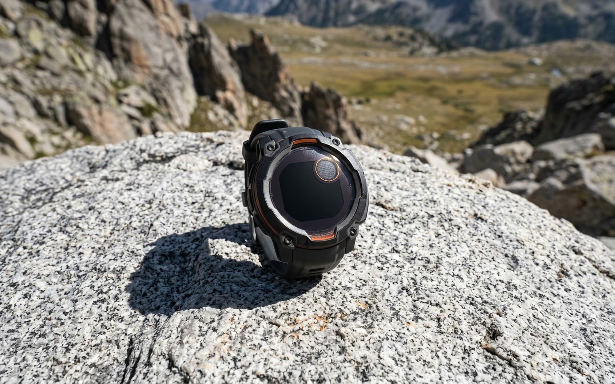 Garmin Instinct 3 Solar Power Glass transparent solar lens resting on granite rock harvesting direct sunlight outdoors