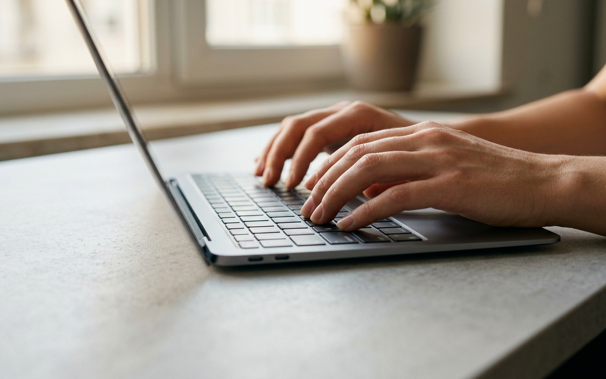 Lenovo laptop screen showing Windows 11 Device Manager keyboard driver reinstallation process, hands on keyboard
