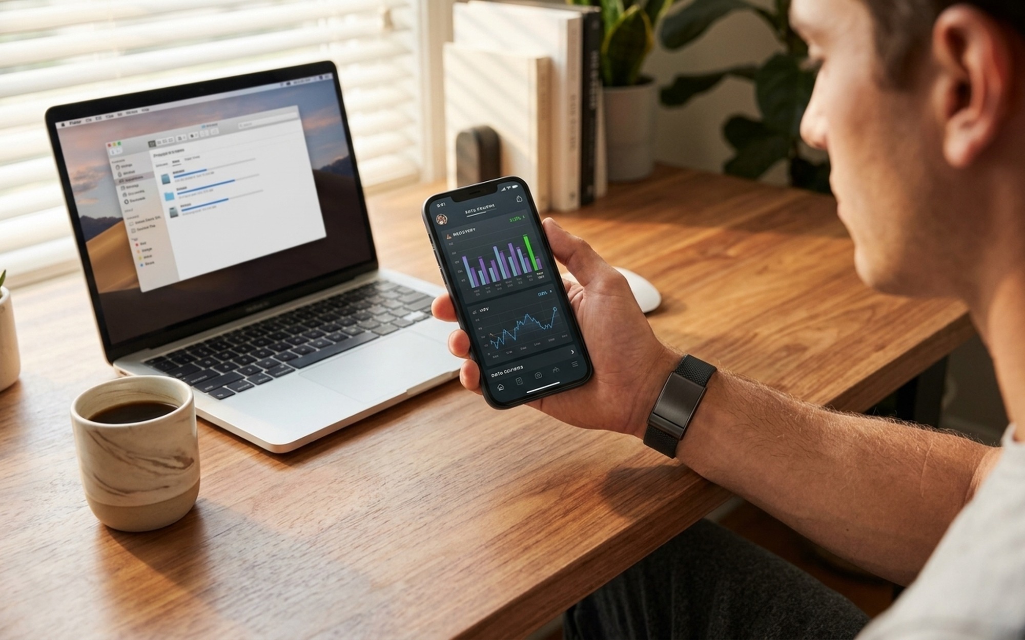 Man reviewing WHOOP AI Coach recovery score and HRV trends on smartphone at wooden desk with fitness tracker on wrist