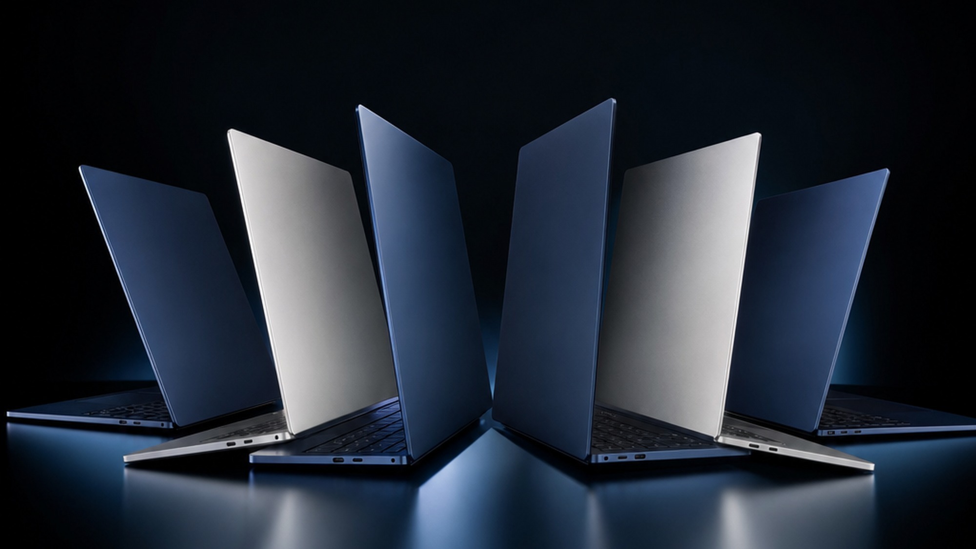 Lineup of thin NVIDIA RTX Spark laptops from several PC brands displayed on a dark gradient studio background
