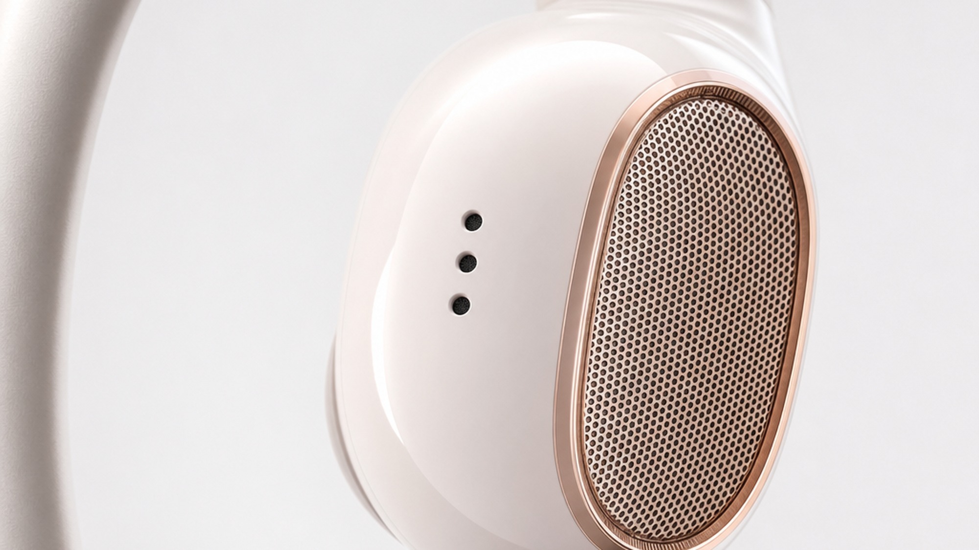 Close-up of Shokz OpenDots 2 earbud microphone array showing bone-conduction sensor mesh and dual air-conduction mic ports on the driver housing