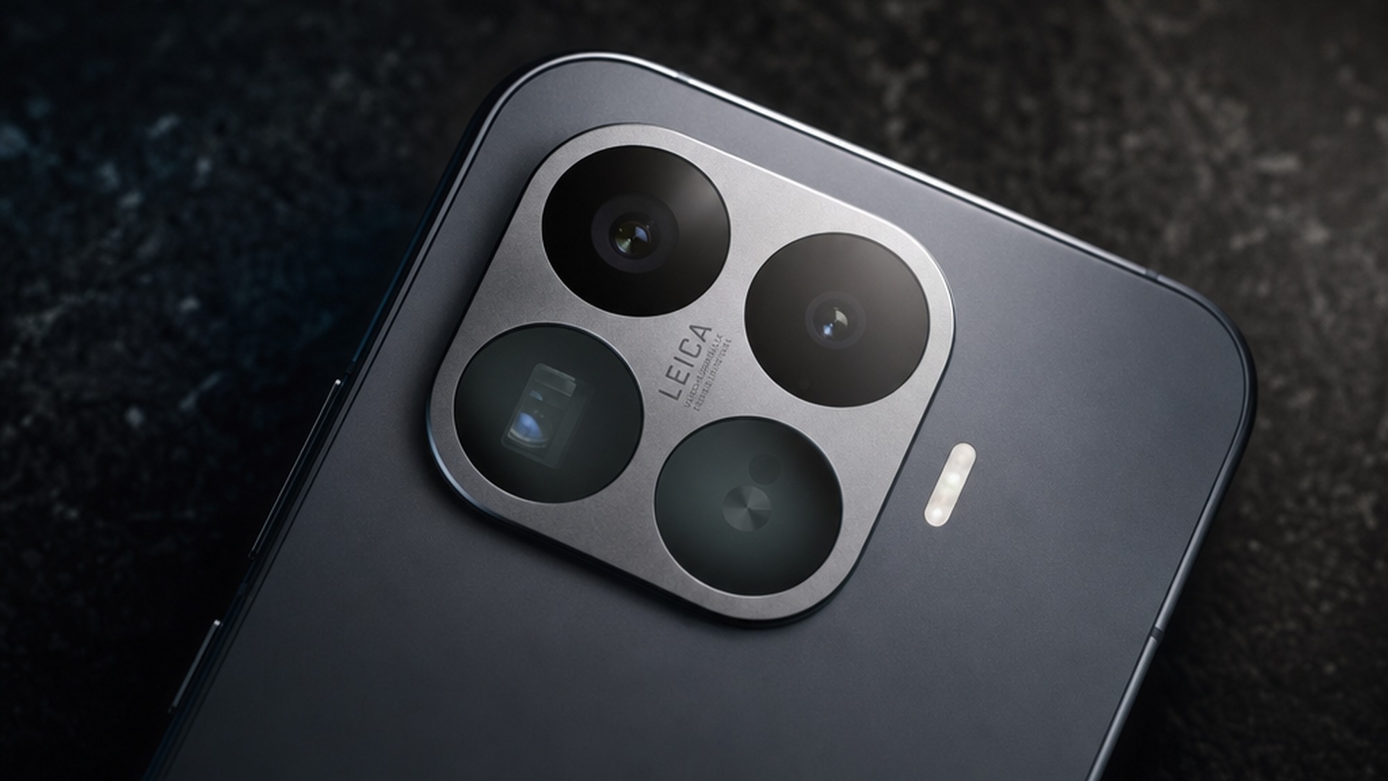 Close up of the Xiaomi 17T Pro rear camera module showing the Leica branded square plate with its triple lens layout on a dark surface.