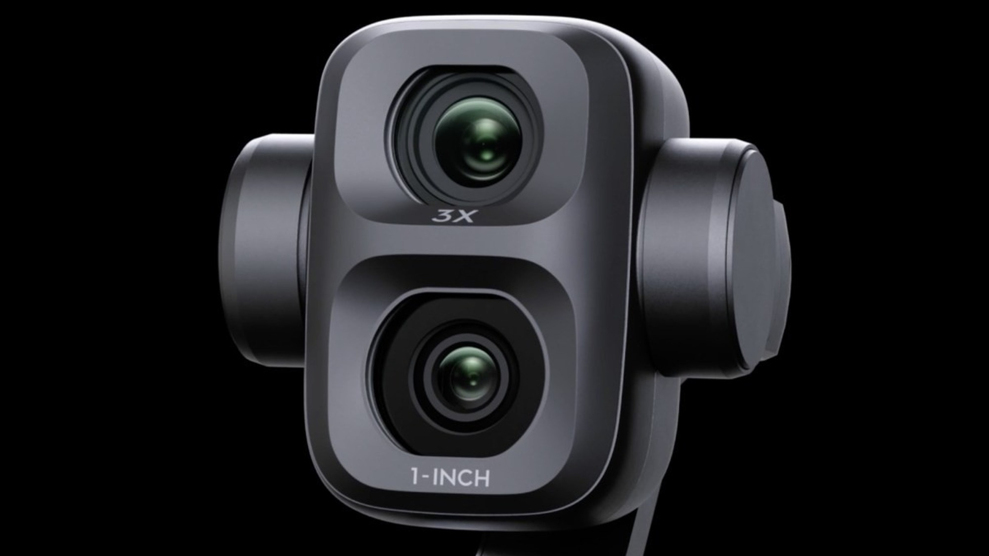 Close up of the DJI Osmo Pocket 4P dual lenses with the 60mm telephoto and 1-inch wide sensor labels on the gimbal head
